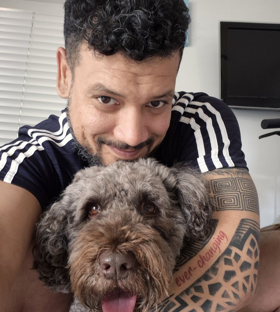 Frankly K9 trainer with a happily trained client dog